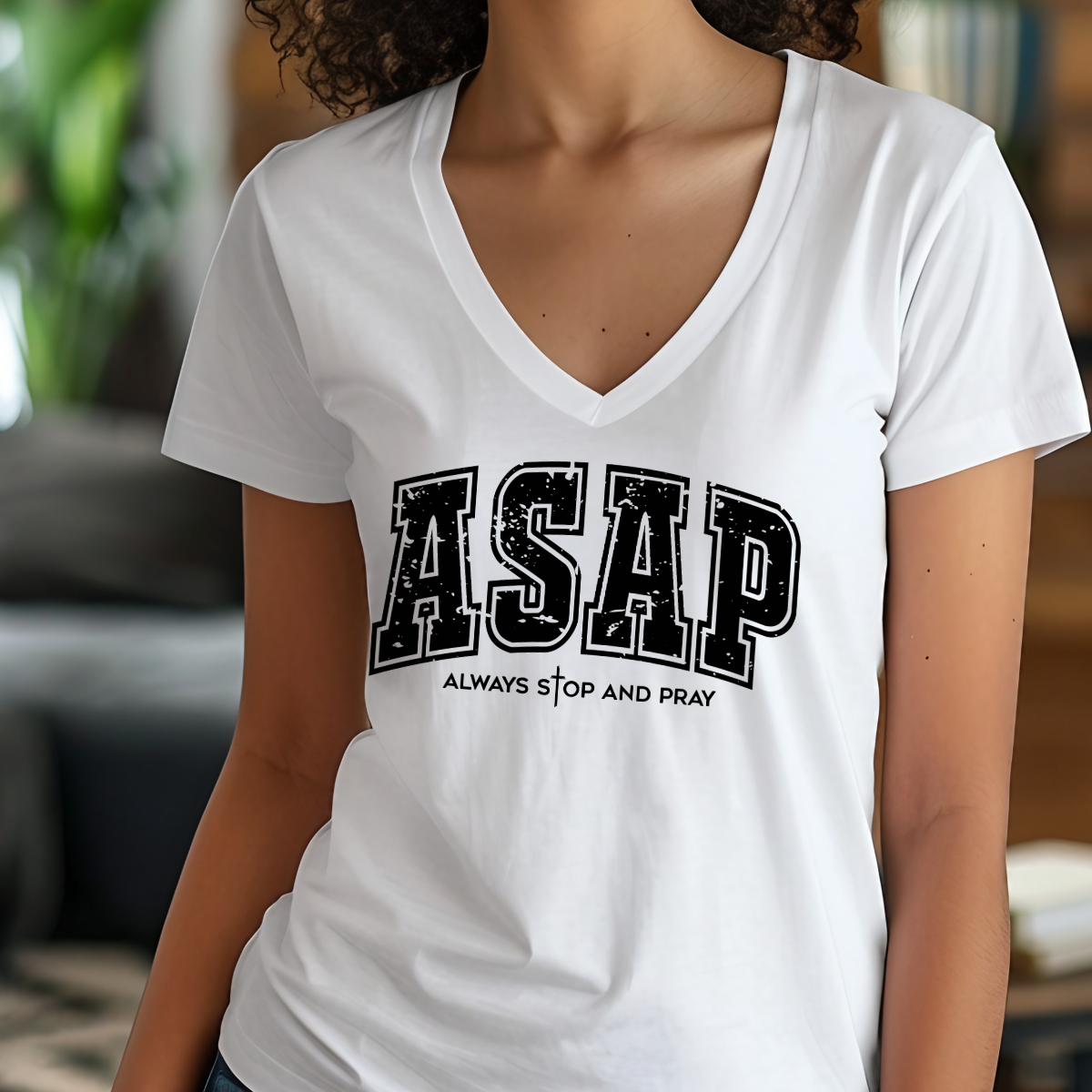 Person wearing a white t-shirt with 'ASAP Always Stop and Pray' text.